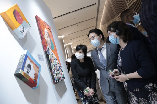 Invited guests get a guided tour of the exhibitions