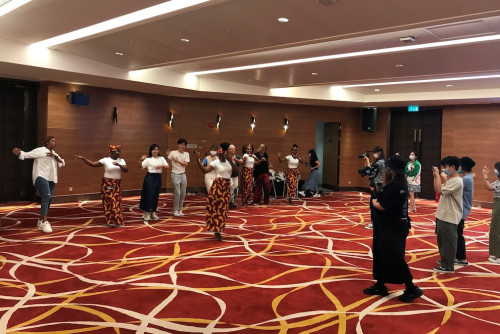 Artists teach workshop participants a traditional Mozambican dance